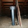 This flue pipe obviously terminates in the attic.  It was from a heater in Santa Rosa.  If you look carefully, you will notice that the wood immediately adjacent to the cap is scorched.  