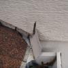 Diverter or "kickout" flashing at the termination of a roof/wall connection will direct water into the gutter instead of allowing it to flow down the exterior of the building.  The only improvement that I would like to see is caulking where the flashing exits the siding.