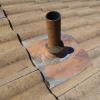 Lead flashings are typically used on concrete tile roofs.  As the lead heats and cools, the sheet lead will stress and tear, resulting in leaks.