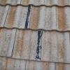 In this case, mastic has been used to glue tiles back together.  Once again, a temporary patch, not a permanent repair.